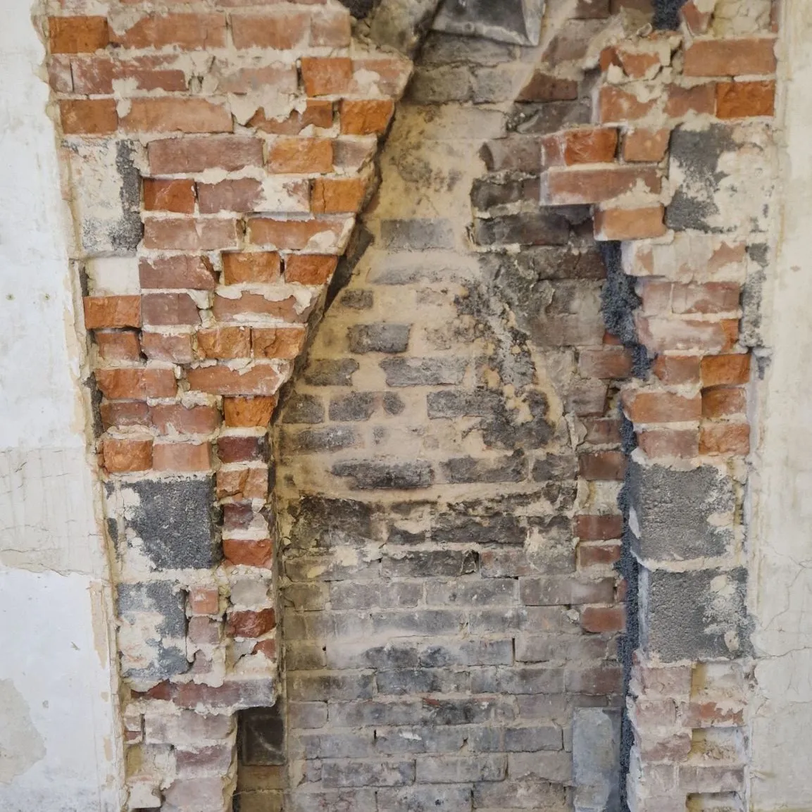 Old brick wall opened up for structural work